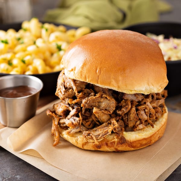 Pappies Smokehouse & Lunch Box pulled pork sandwich with macaroni and cheese and coleslaw.