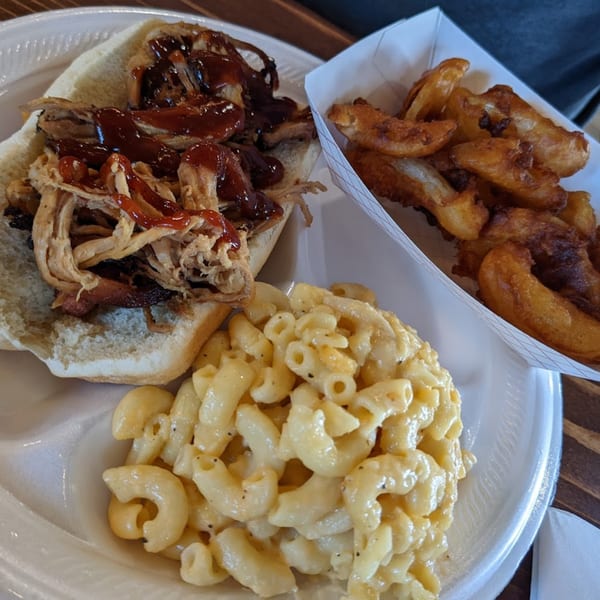 Pappies Smokehouse & Lunch Box pulled pork sandwich with mac and cheese and fries.